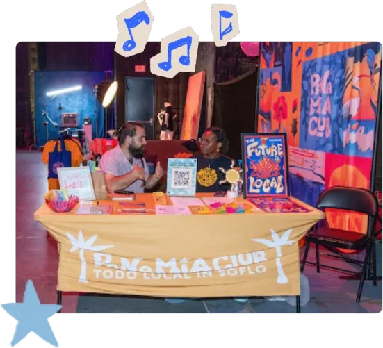 Panas at the Pana MIA Club table at the Subtropic Film Fest collaboration